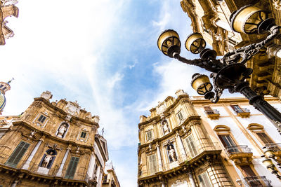 Low angle view of historical building against cloudy sky