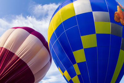 Low angle view of hot air balloon against blue sky