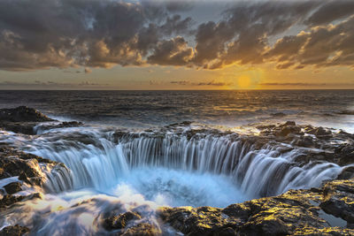 Scenic view of sea against sky during sunset