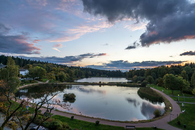 Scenic view of lake against sky at sunset