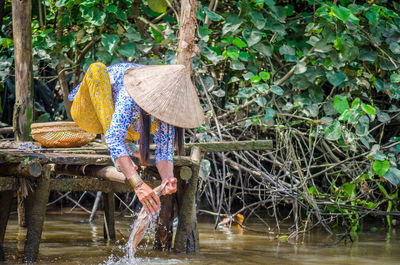 Man with umbrella in water