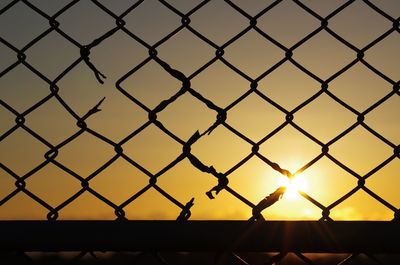 Full frame shot of sky seen through chainlink fence