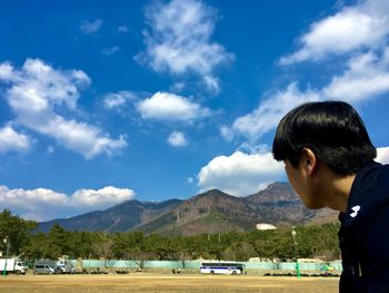 Man looking at mountains