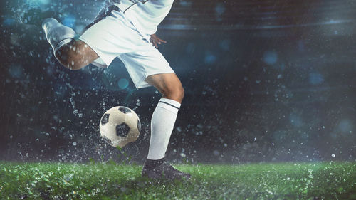 Low angle view of man playing soccer ball