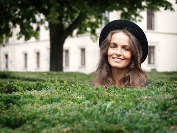 Portrait of a smiling young woman on grass