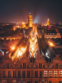 High angle view of illuminated buildings in gdansk at night 