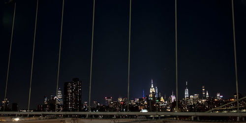 Illuminated modern buildings in city at night