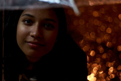 Close-up portrait of smiling young woman