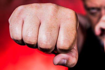 Close-up of man clenching fist