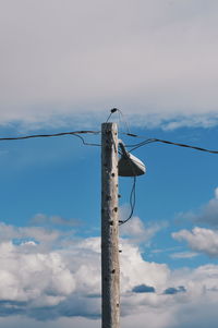 Low angle view of pole against sky