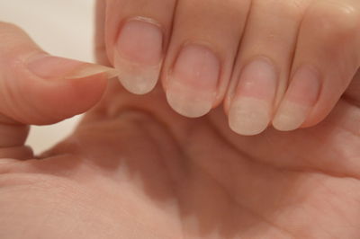 Man's hand.natural long nails.healthy nails.girl's hand.fingers.close-up.no polish.