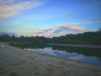 Scenic view of lake against sky during sunset