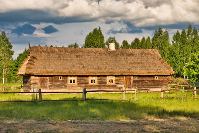 House on field against sky