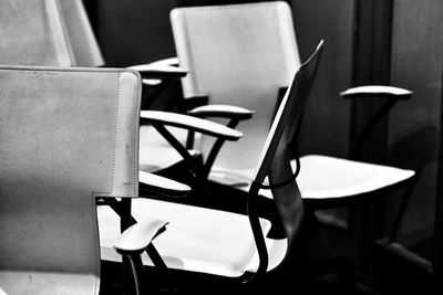 Close-up of empty chairs and table