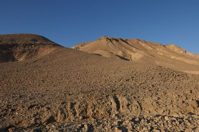 Scenic view of desert against clear sky