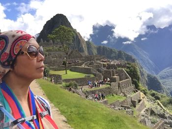 Portrait of woman standing on mountain