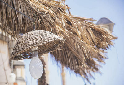 Lamp under thatched roof on the street in africa