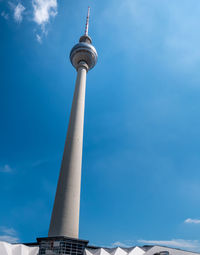 Low angle view of communications tower against sky