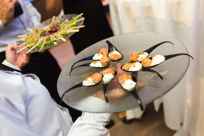 High angle view of flowers in plate on table