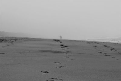 Scenic view of beach against clear sky