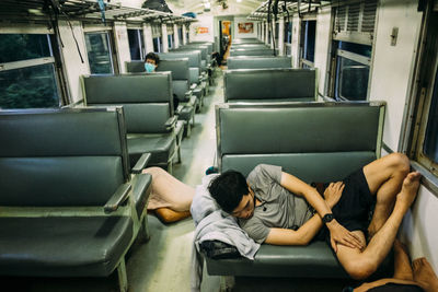 Young man sleeping in train