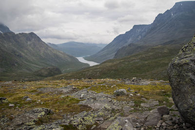 Scenic view of mountains against cloudy sky