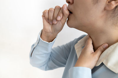 Midsection of man against white background