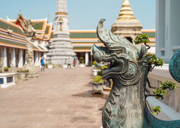 Statue of temple outside building