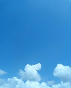 Low angle view of clouds in blue sky