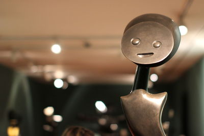 Close-up of metal with anthropomorphic face at night