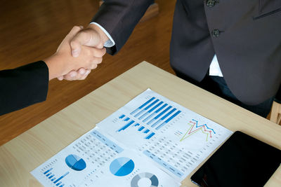 Close-up of hands on table