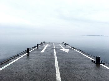 Empty road along ocean