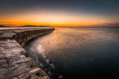 Scenic view of sea against sky during sunset