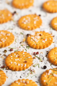 Close-up of salted crackers on table