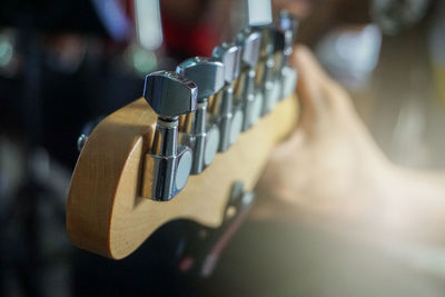 Midsection of man playing guitar