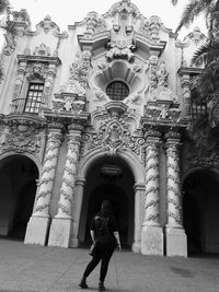 Full length of woman in front of building