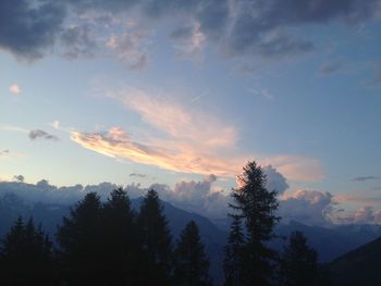 Scenic view of mountains against cloudy sky