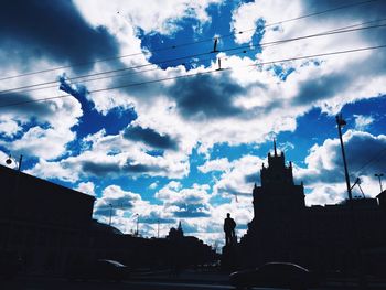 Low angle view of building against cloudy sky