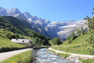 Scenic view of mountains against blue sky