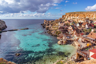 Scenic view of sea against cloudy sky