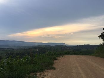 Scenic view of field against sky during sunset