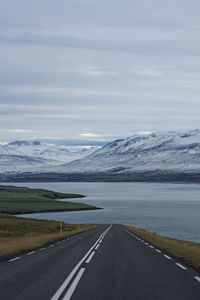 Road by sea against sky