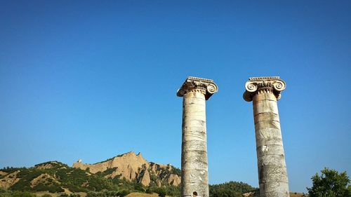 Low angle view of castle against blue sky