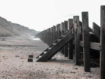 Scenic view of beach, steps and sea defense