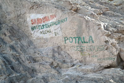 Close-up of text on wall