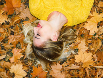 High angle view of woman lying down during autumn