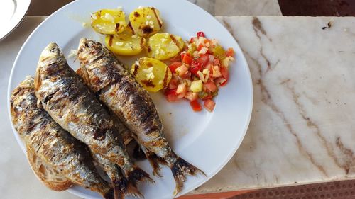 High angle view of sardines in plate