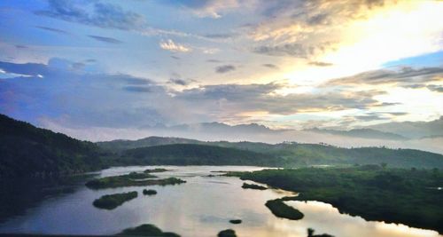 Scenic view of lake at sunset