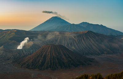 Scenic view of mountain range against sky during sunset