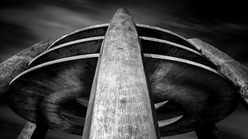 Low angle view of a metal springbrunnen against sky